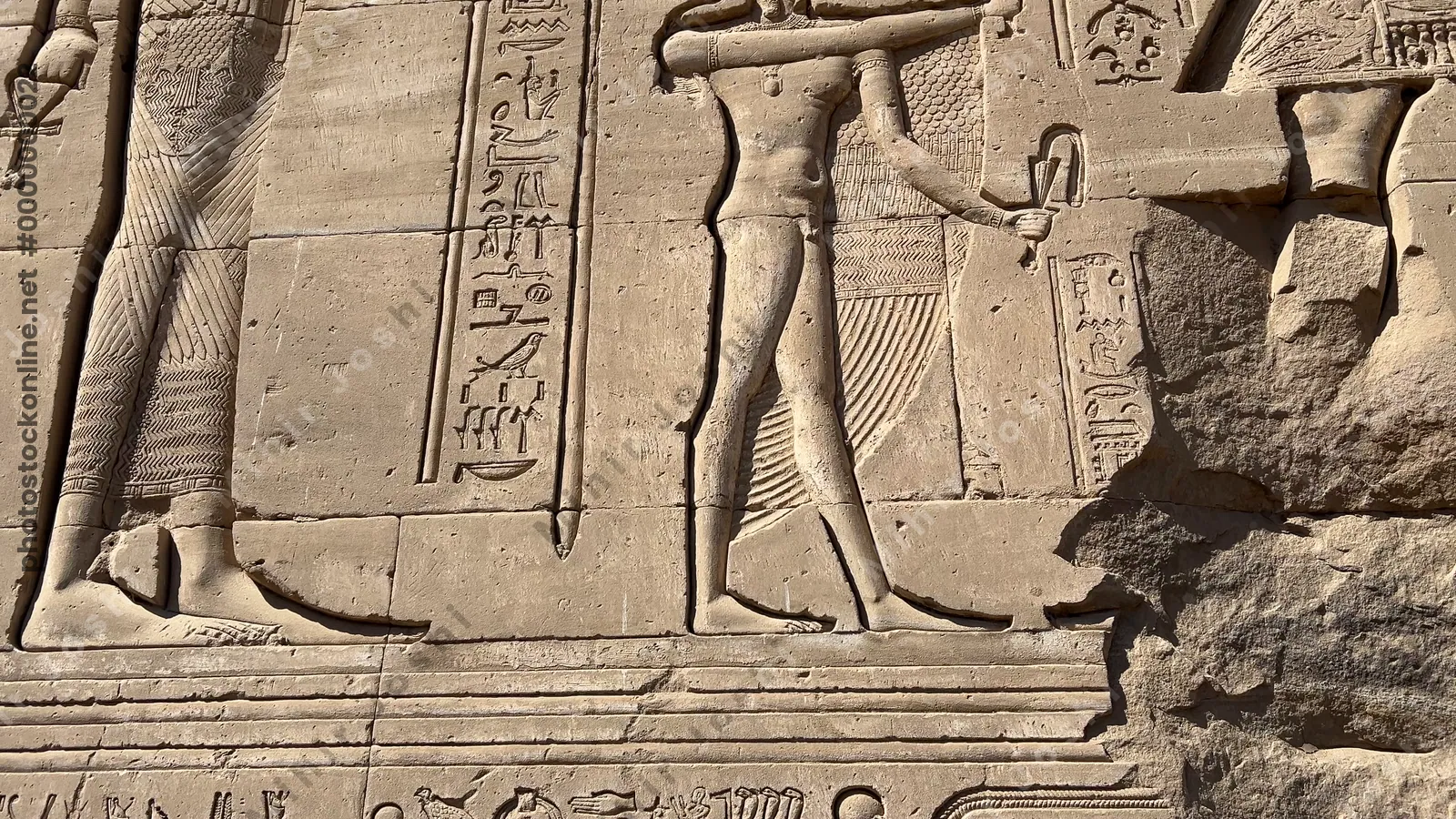 Carved relief of pharaoh with deities at Dendera Temple, Egypt