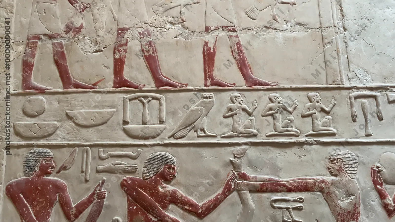 Saqqara, Egypt - Feb 5, 2024: Ancient Egyptian relief from Princess Idut's mastaba in Saqqara, depicting ritual bull sacrifice as part of funerary customs.
