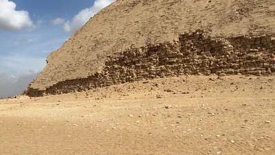 Dahshur, Egypt - Feb 5, 2024: View of Red Pyramid in the foreground with the Bent Pyramid in the background at Dahshur, both built by Pharaoh Sneferu during Old Kingdom.