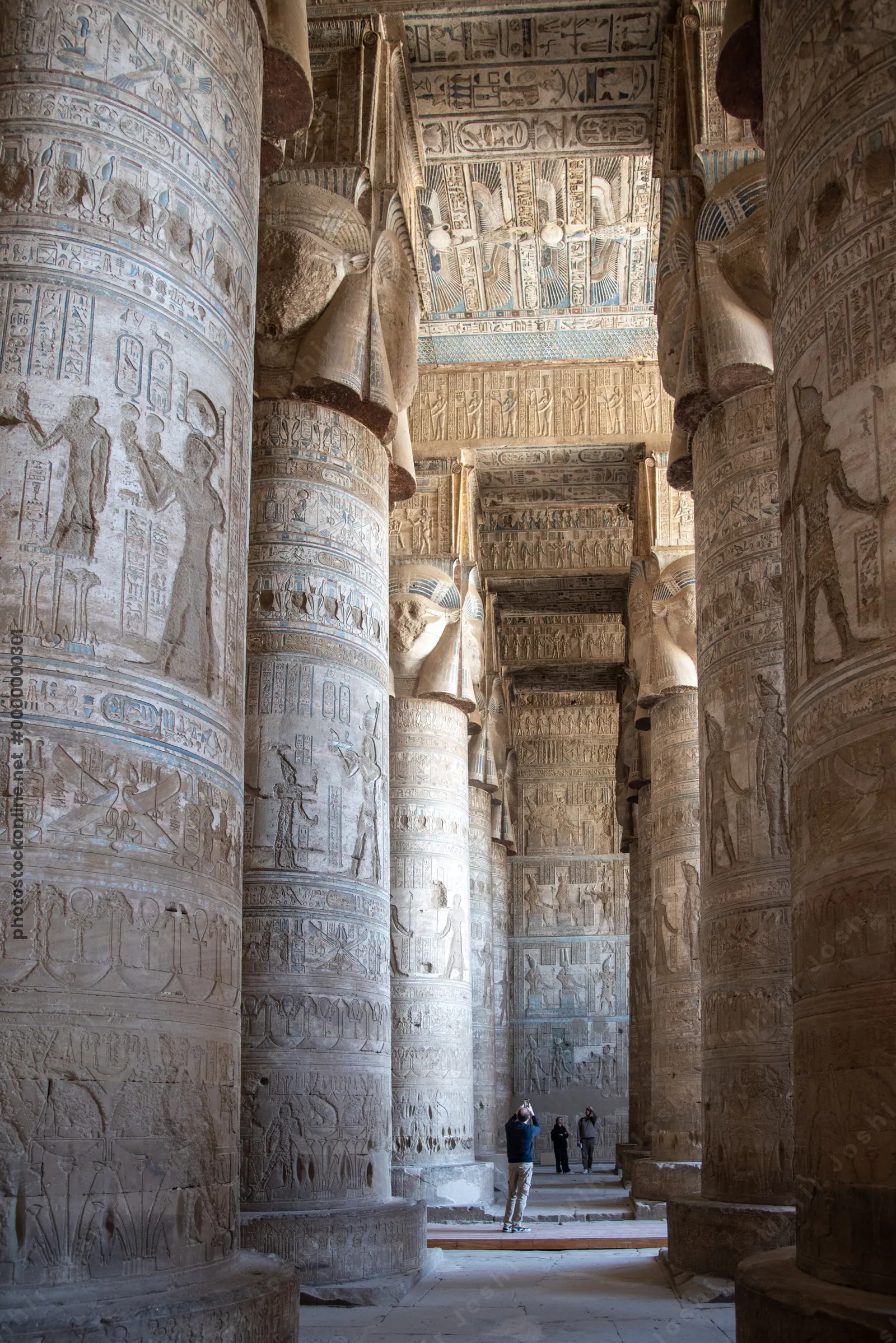 Hypostyle Hall at Dendera Temple supported by 24 sistrum-headed Hathor columns, showcasing ancient Egyptian architecture and iconography