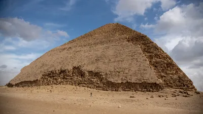 Dahshur, Egypt - Feb 5, 2024: The Bent Pyramid at Dahshur, built by Pharaoh Sneferu during the Old Kingdom, shows a unique change in angle midway up its structure.