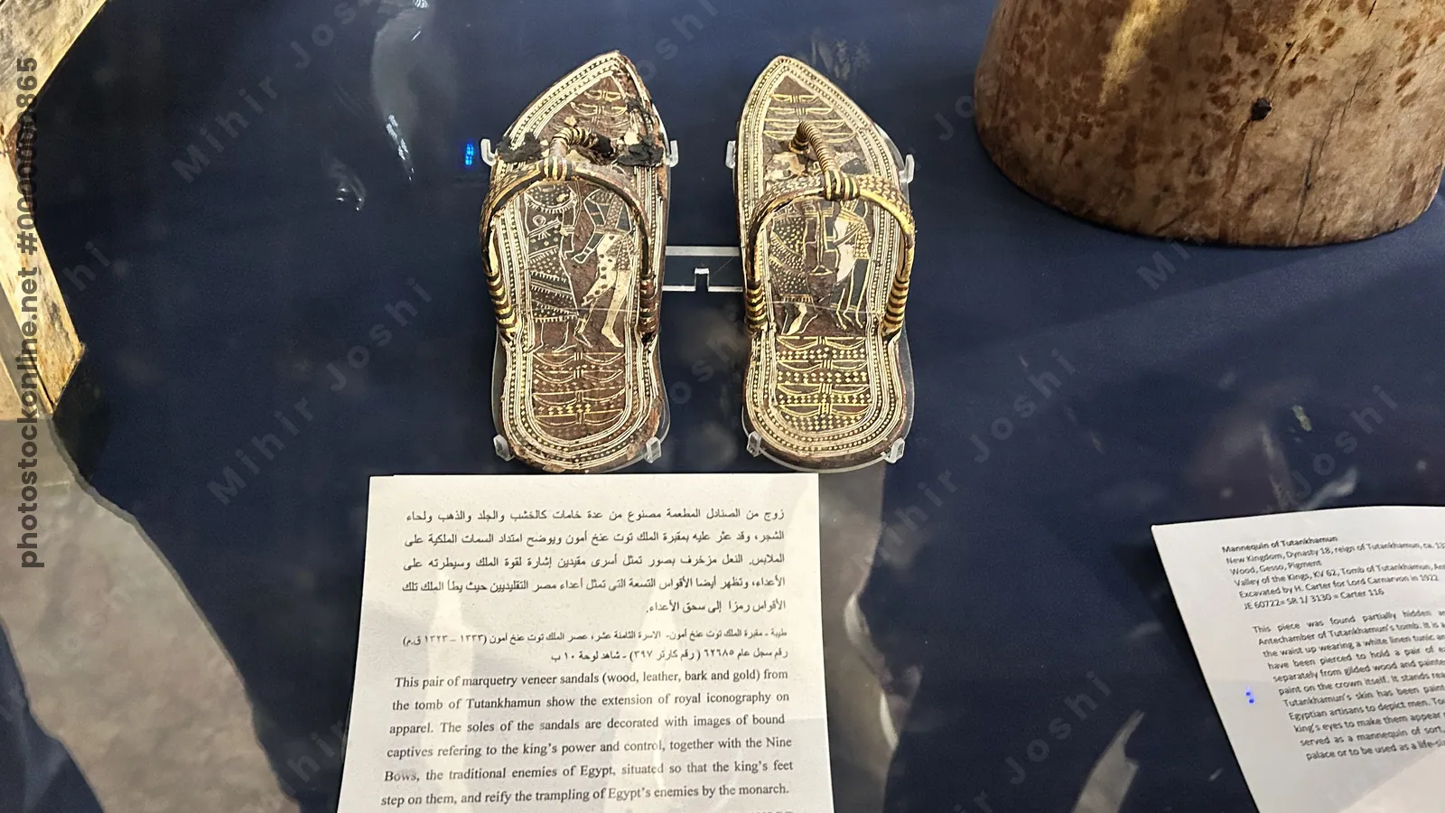 Cairo, Egypt - Feb 4, 2025: Pair of finely crafted marquetry veneer sandals from the tomb of Tutankhamun, symbolizing royal luxury, now displayed at the Egyptian Museum in Cairo.