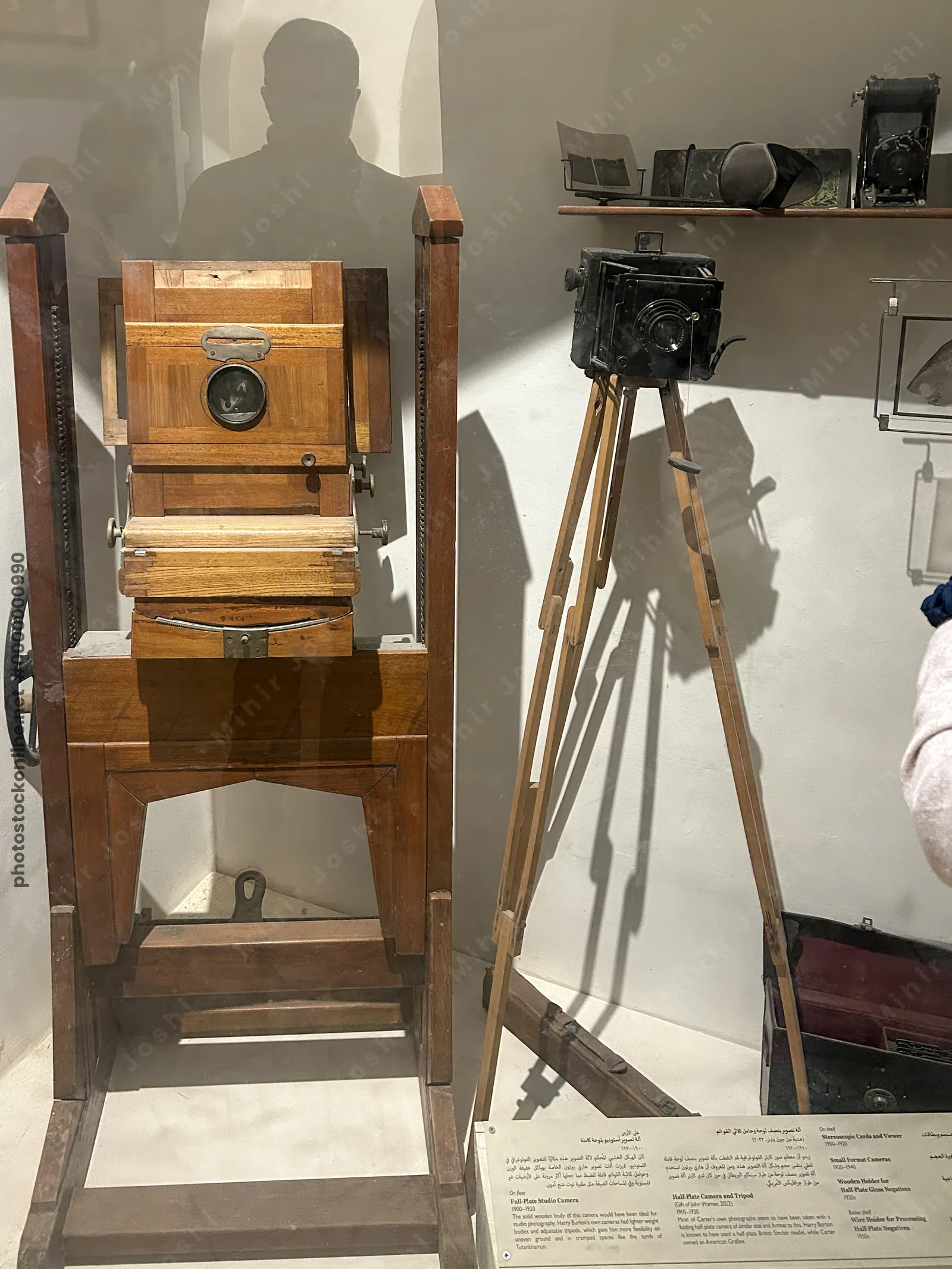 Luxor, Egypt - Feb 11, 2025: Antique wooden and metal field and plate cameras with tripods on display at Howard Carter's House (Carter House) museum.