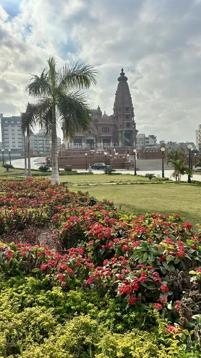 Heliopolis, Cairo, Egypt - Feb 4, 2024: Lush garden with the historic Baron Empain Palace in the background, a Hindu-style mansion in Heliopolis, Cairo