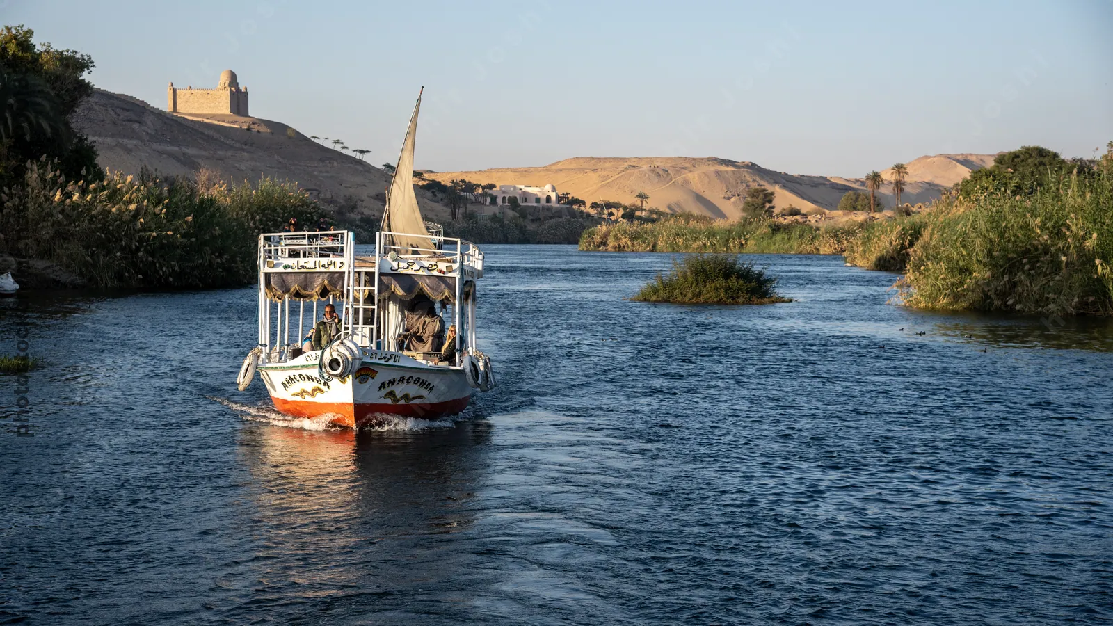Tour boats cruising the Nile River at Aswan, Egyp