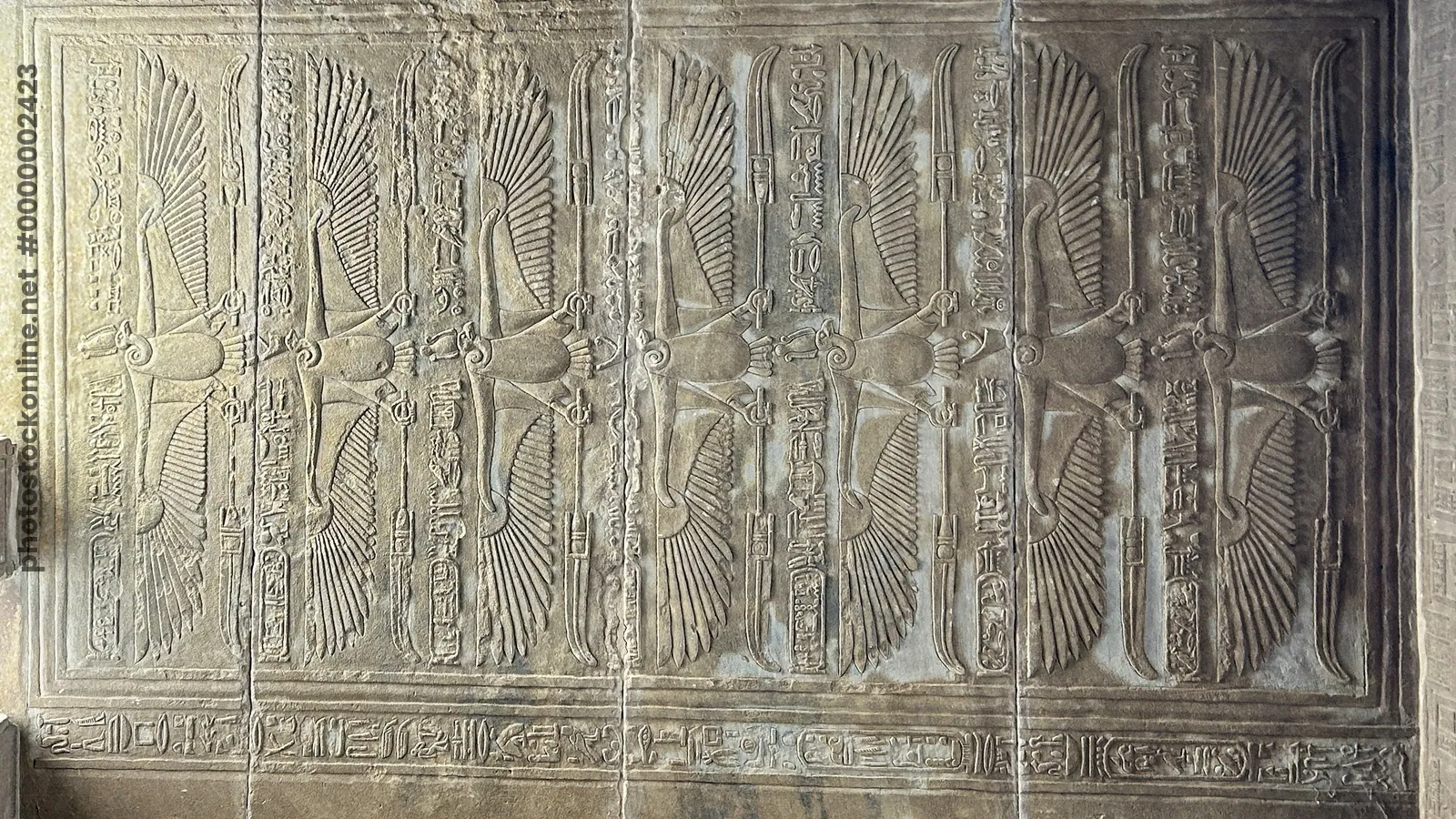 Detailed carvings of vultures, symbols of the god