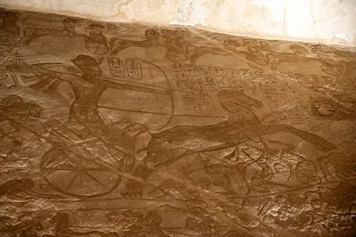Relief of Ramesses II on chariot drawing a bow in