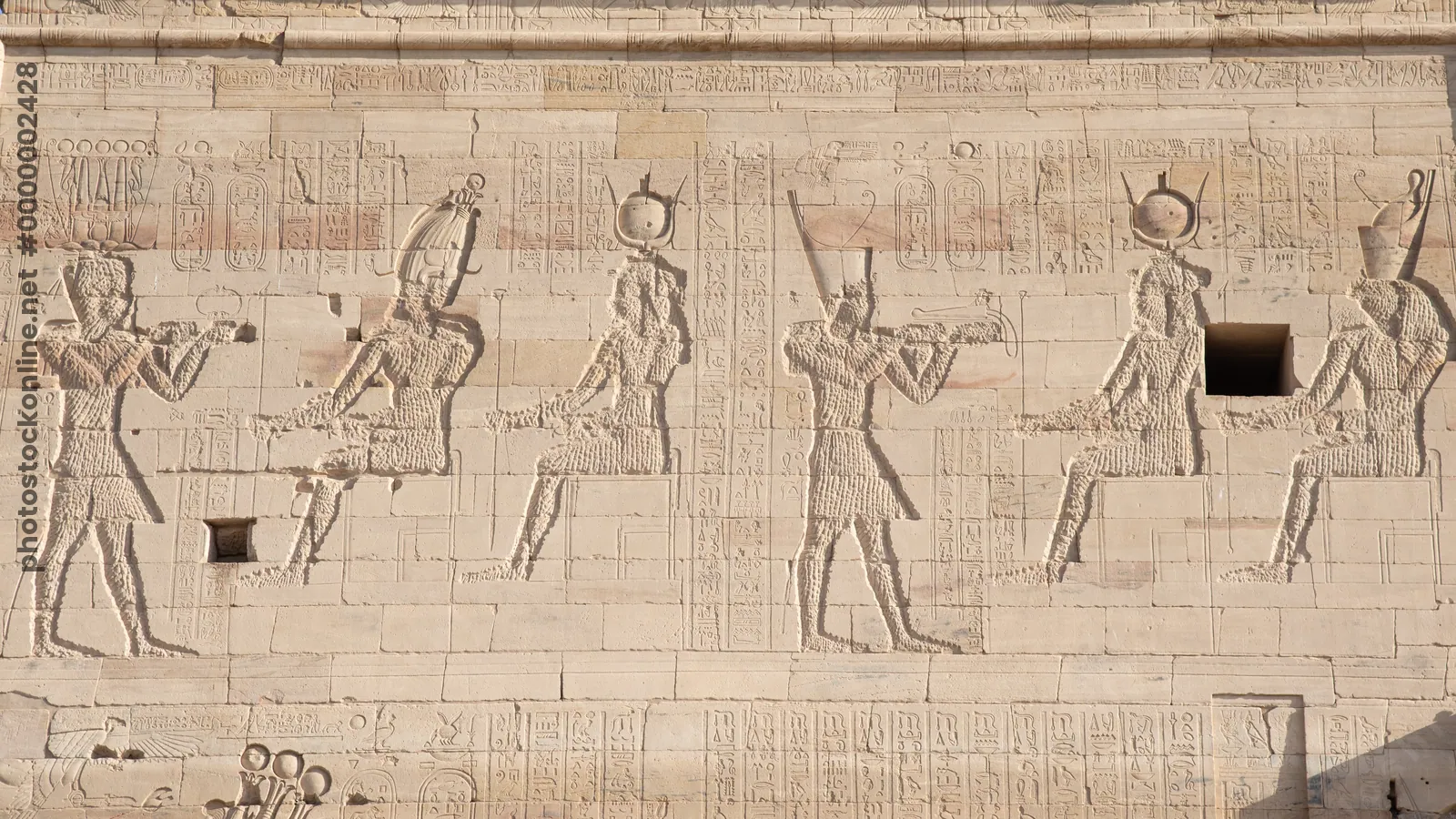 Ancient Egyptian bas-reliefs on first pylon of Is
