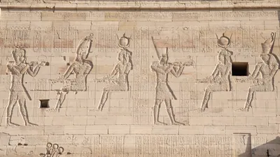 Ancient Egyptian bas-reliefs on first pylon of Is