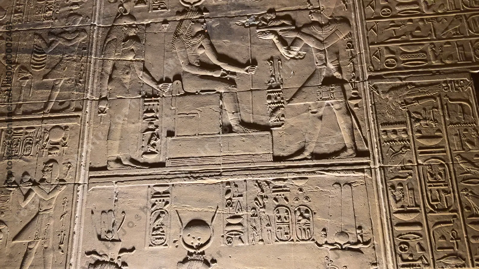 Wall at the Temple of Philae in Aswan, Egypt, wit