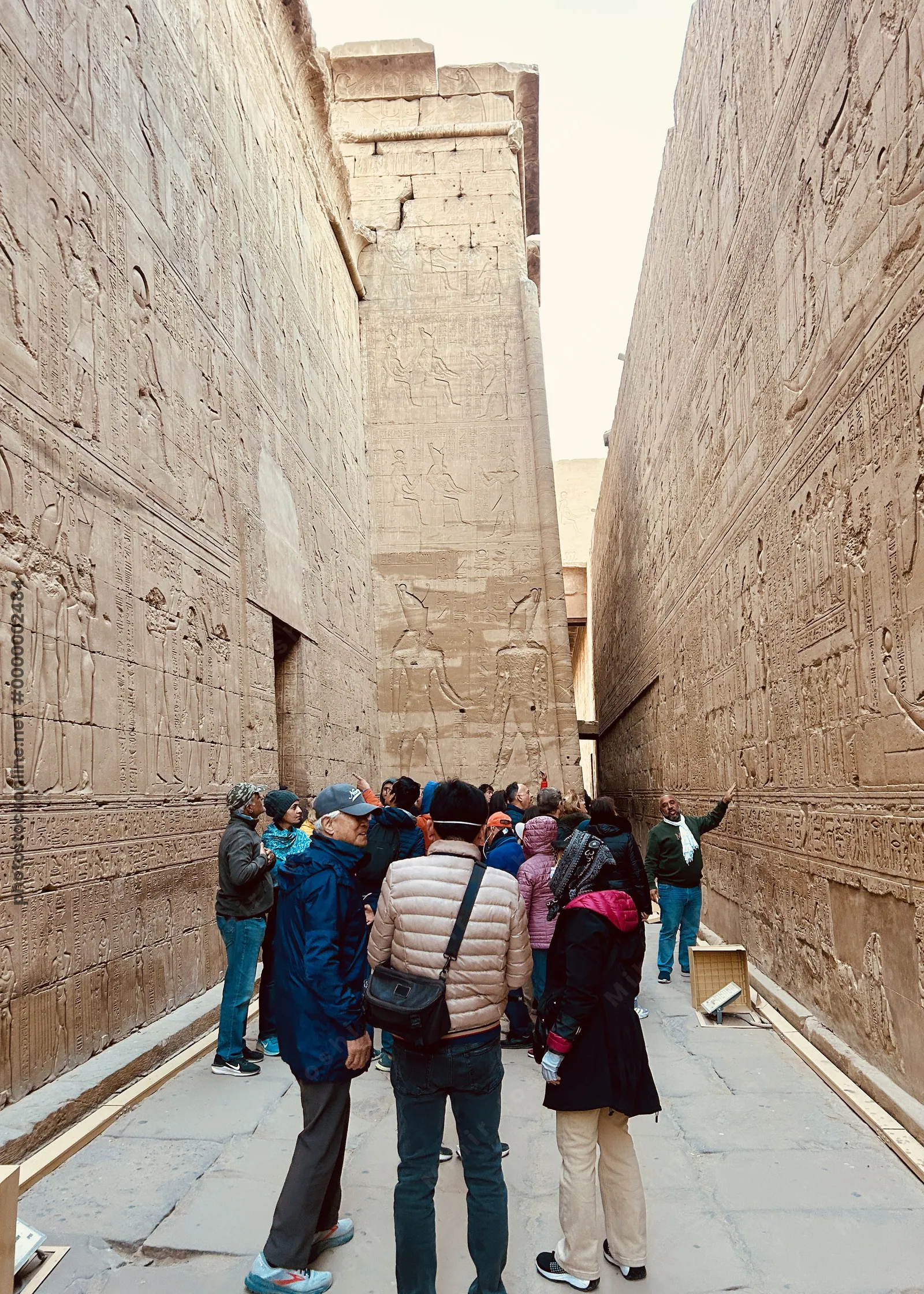Visitors in passage at Temple of Horus, Edfu, Egy