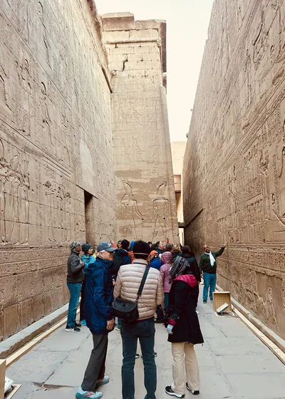Visitors in passage at Temple of Horus, Edfu, Egy