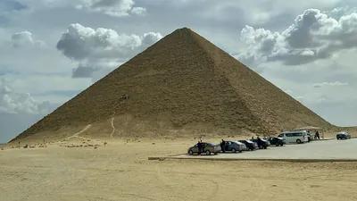 Tourist vehicles parked near the Red Pyramid at D