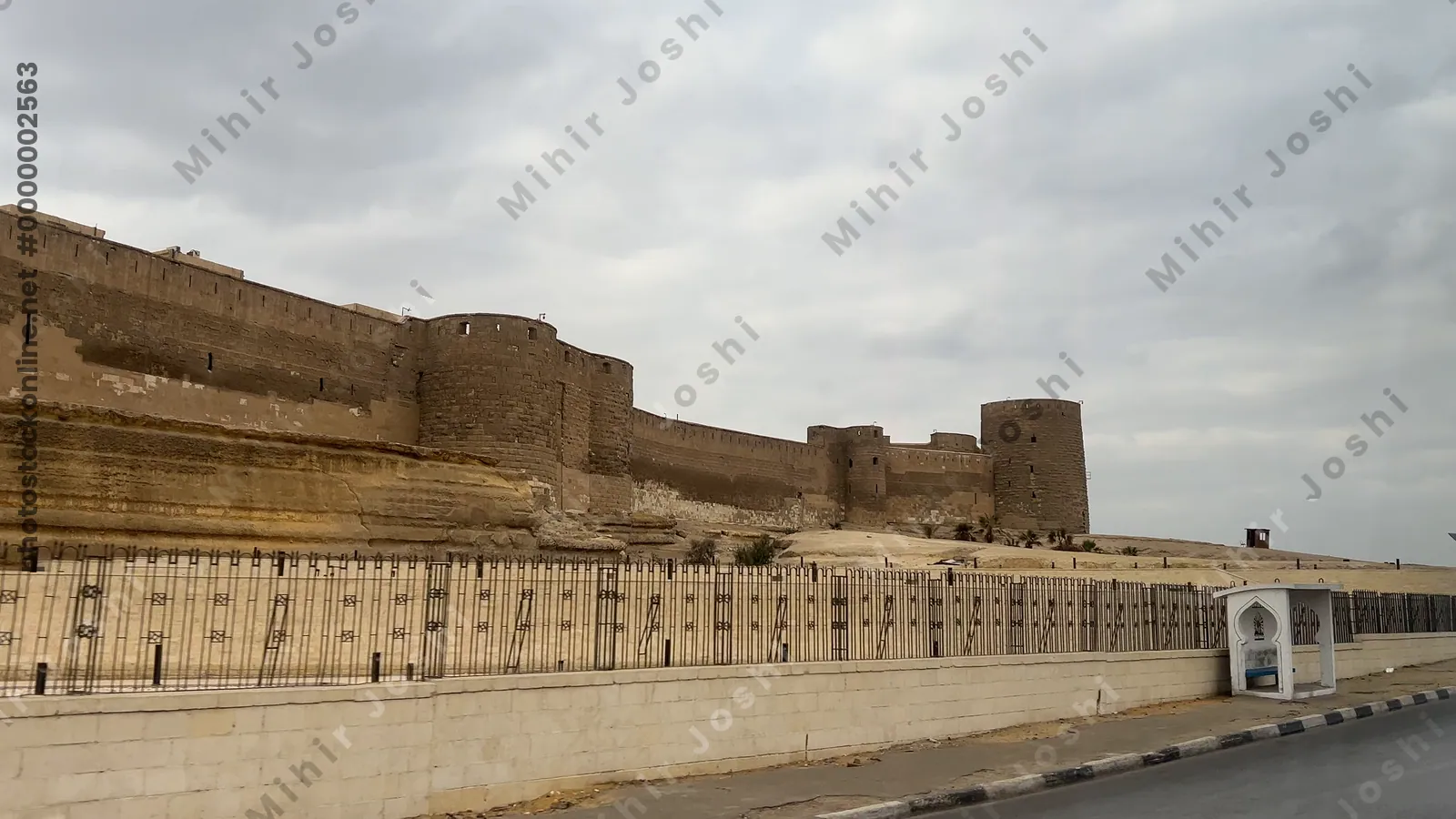 Moving view of the Citadel of Cairo’s historic ramparts, captured from a bus passing the medieval Islamic-era fortification.