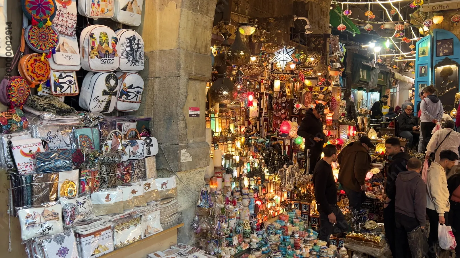Cairo, Egypt - Feb 12, 2025: Brightly lit lamps and lanterns displayed in the bustling street market of Khan el-Khalili, the famous bazaar in historic Cairo.
