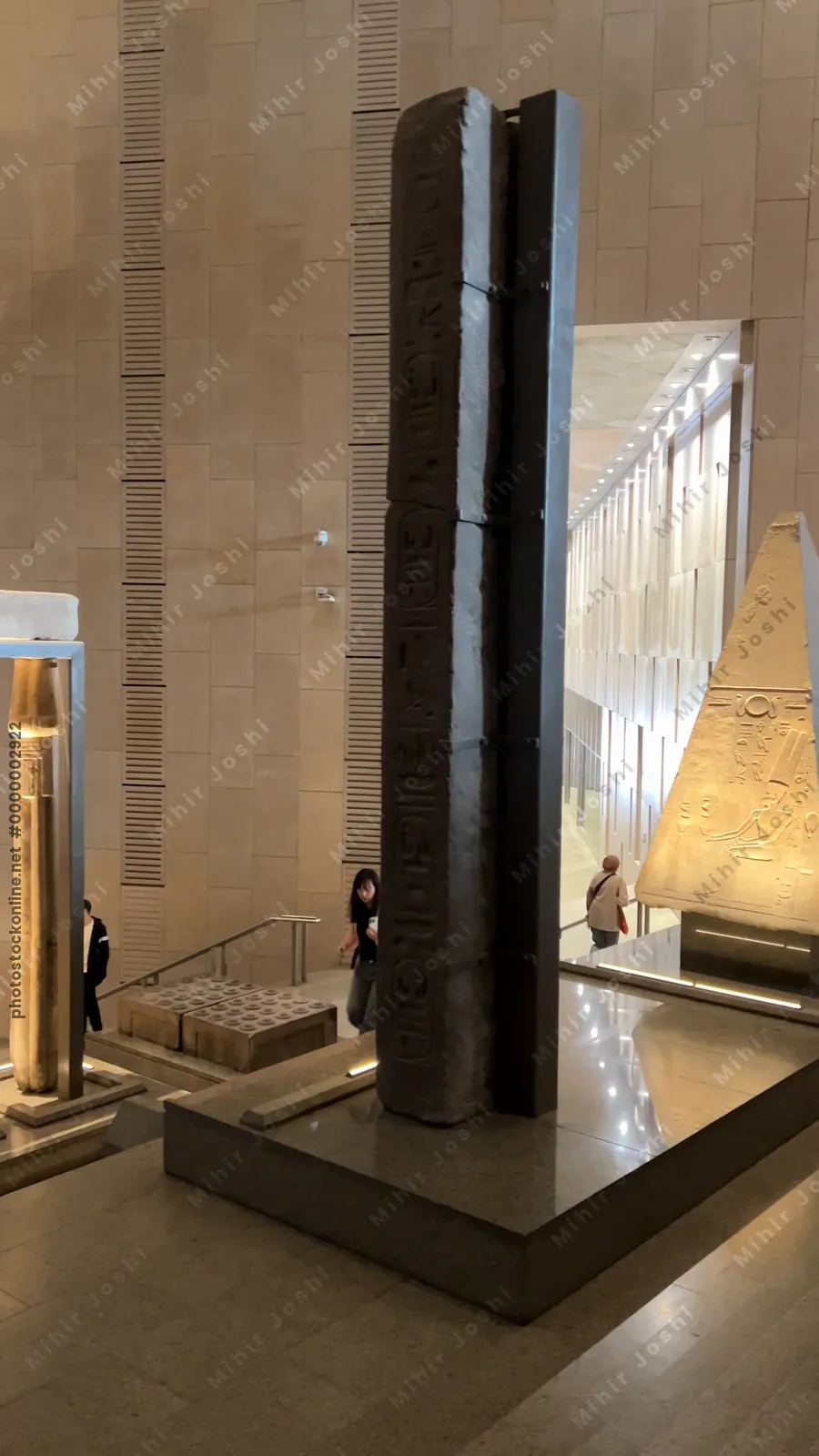 Giza, Egypt - Feb 6, 2025: View of the Grand Staircase at the Grand Egyptian Museum in Cairo, showcasing majestic pharaonic statues and vertical gallery design.