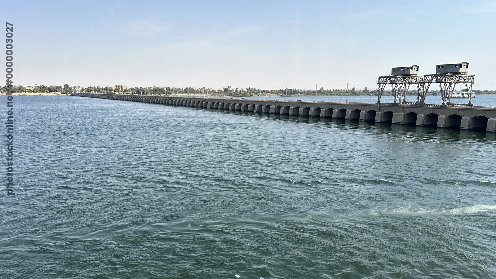 Esna, Egypt - Feb 9, 2025: View of the Esna Lock on the Nile River, a major waterway structure near Luxor used for navigation of cruise ships and vessels.