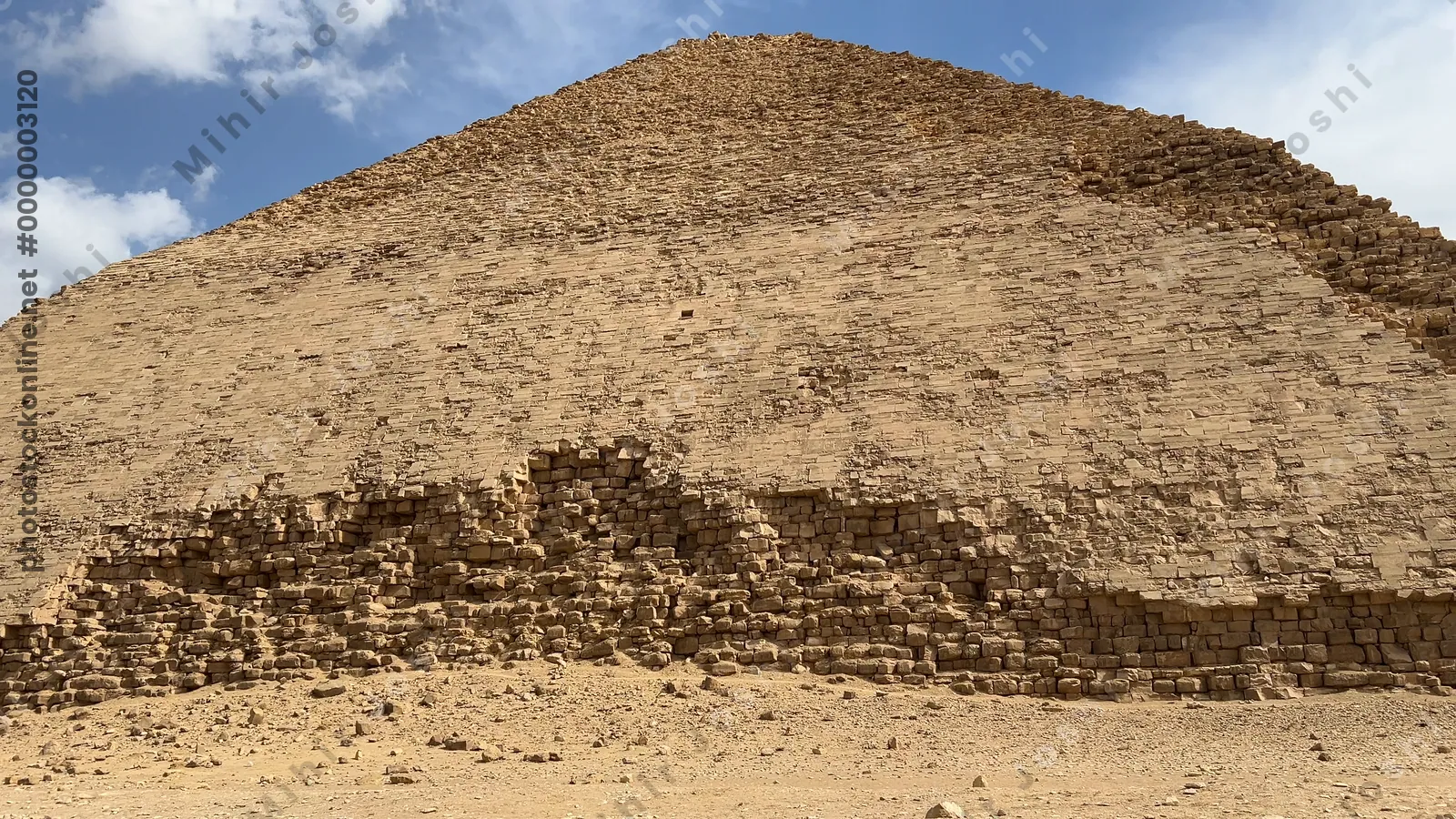 Dahshur, Egypt - Feb 5, 2024: The Bent Pyramid at Dahshur, built by Pharaoh Sneferu during the Old Kingdom, shows a unique change in angle midway up its structure.