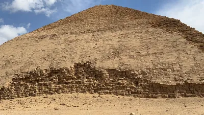 Dahshur, Egypt - Feb 5, 2024: The Bent Pyramid at Dahshur, built by Pharaoh Sneferu during the Old Kingdom, shows a unique change in angle midway up its structure.