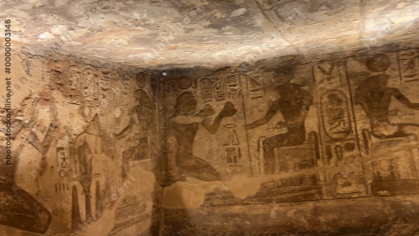 Walls of Abu Simbel Temple with Ramesses II making offerings