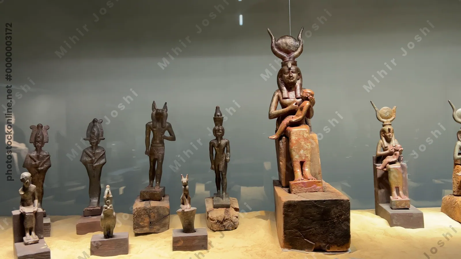 Saqqara, Egypt - Feb 5, 2024: artistry of ancient Egypt with statues of various gods including Osiris, Anubis, Sekhmet, and Isis with Child Horus at the Imhotep Museum in Saqqara.