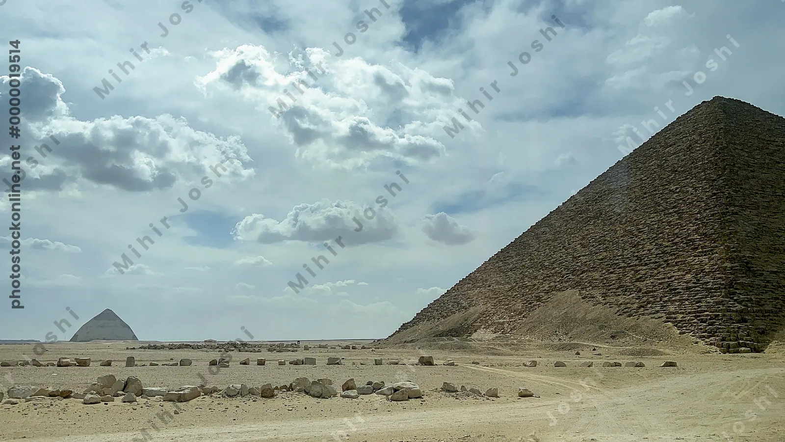 View of Red Pyramid in the foreground with the Bent Pyramid in the background at Dahshur, both built by Pharaoh Sneferu during Old Kingdom.