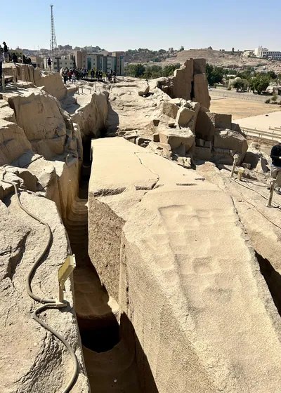 The largest known ancient obelisk, still unfinished, at the northern stone quarries in Aswan, Egypt.