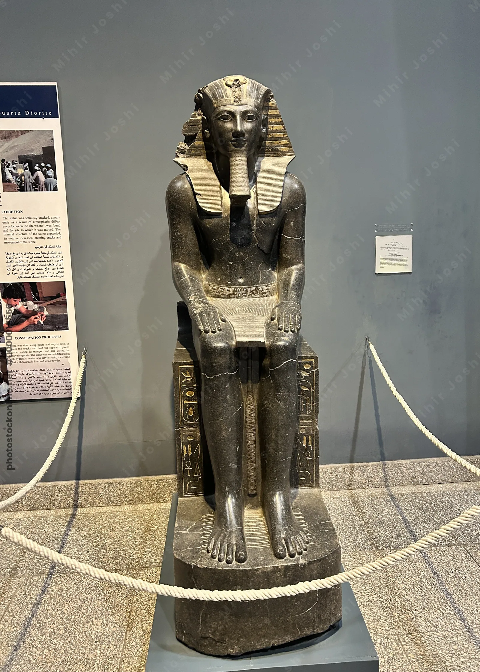 Luxor, Egypt - Feb 9, 2025: Ancient seated statue of Pharaoh Thutmose III from Egypt, displayed in the Luxor Museum as part of its archaeological collection.