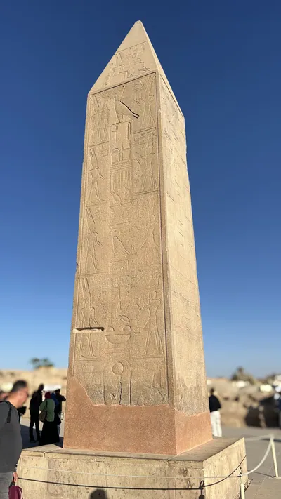 Karnak Temple, Luxor, Egypt - Feb 10, 2025: granite obelisk of Queen Hatshepsut at the temple complex, showcasing ancient architecture.