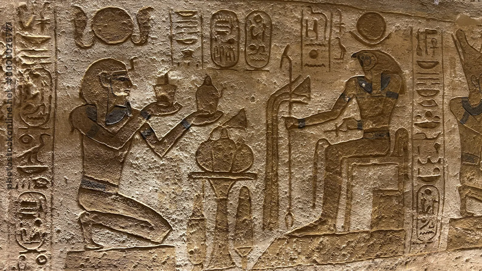 Pharaoh offering to Ra-Horakhty at Abu Simbel temple, Egypt