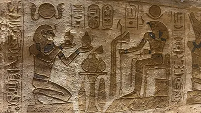 Pharaoh offering to Ra-Horakhty at Abu Simbel temple, Egypt