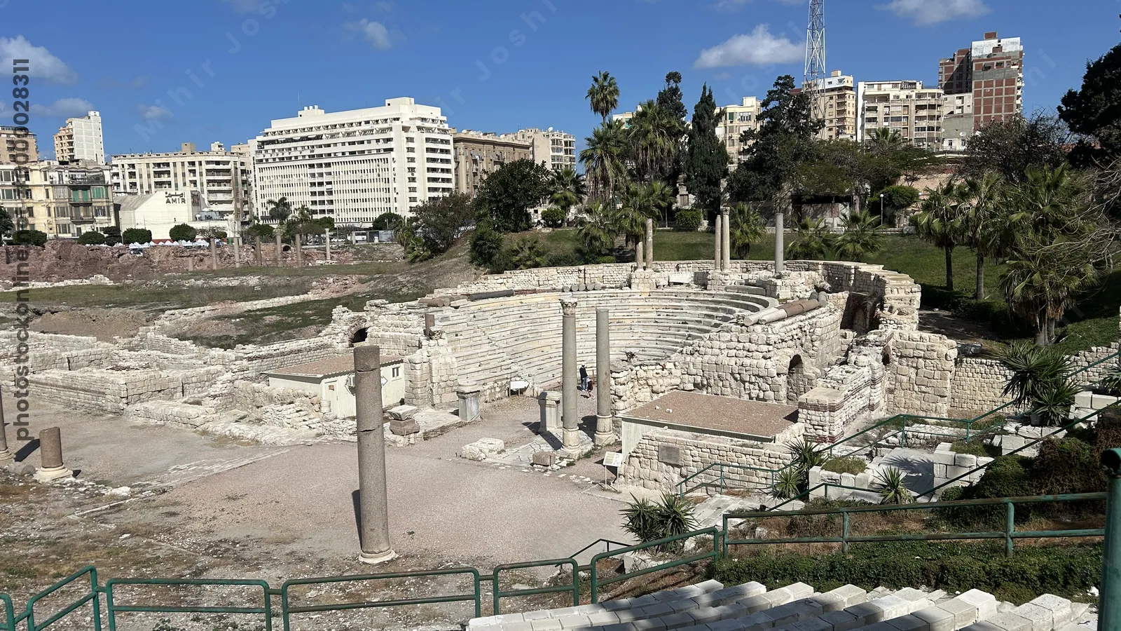 Alexandria, Egypt - Feb 13, 2025: The Roman Amphitheatre in Alexandria, an ancient Greco-Roman landmark featuring marble seating, columns, and ruins,