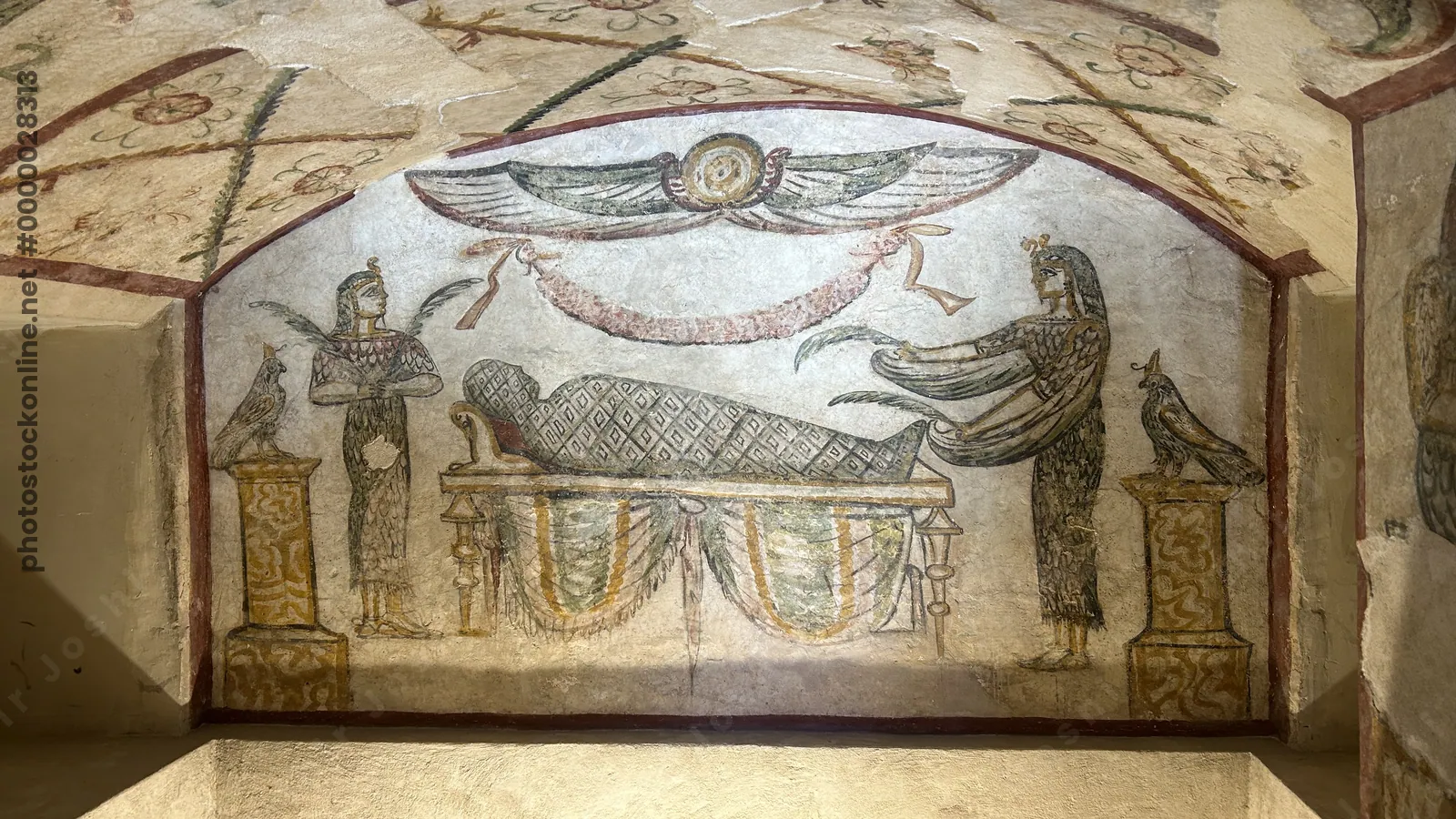Alexandria, Egypt - Feb 13, 2025: Fresco showing goddess Isis assisting in the embalming of a mummy inside the Tomb of Tigran at the Catacombs of Kom