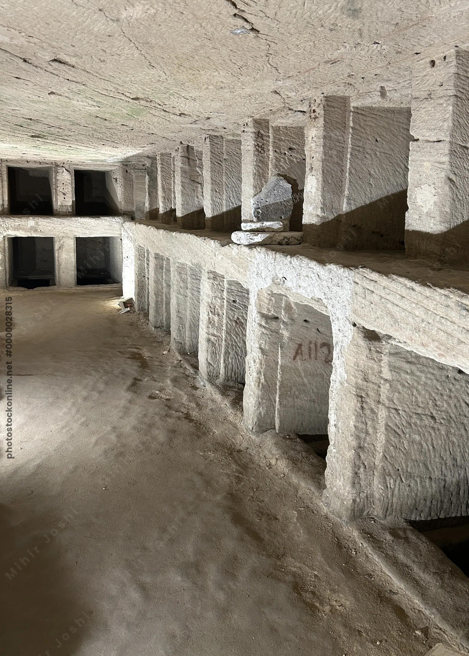 Alexandria, Egypt - Feb 13, 2025: Carved stone burial niches inside the Catacombs of Kom El Shoqafa, a Greco-Roman necropolis and ancient underground