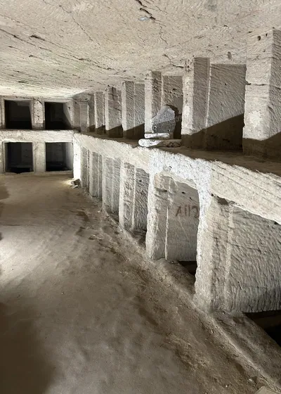 Alexandria, Egypt - Feb 13, 2025: Carved stone burial niches inside the Catacombs of Kom El Shoqafa, a Greco-Roman necropolis and ancient underground