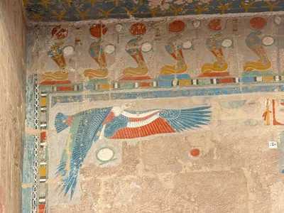 Frieze of uraei with sun disks at Mortuary Temple of Hatshepsut in Luxor, Egypt