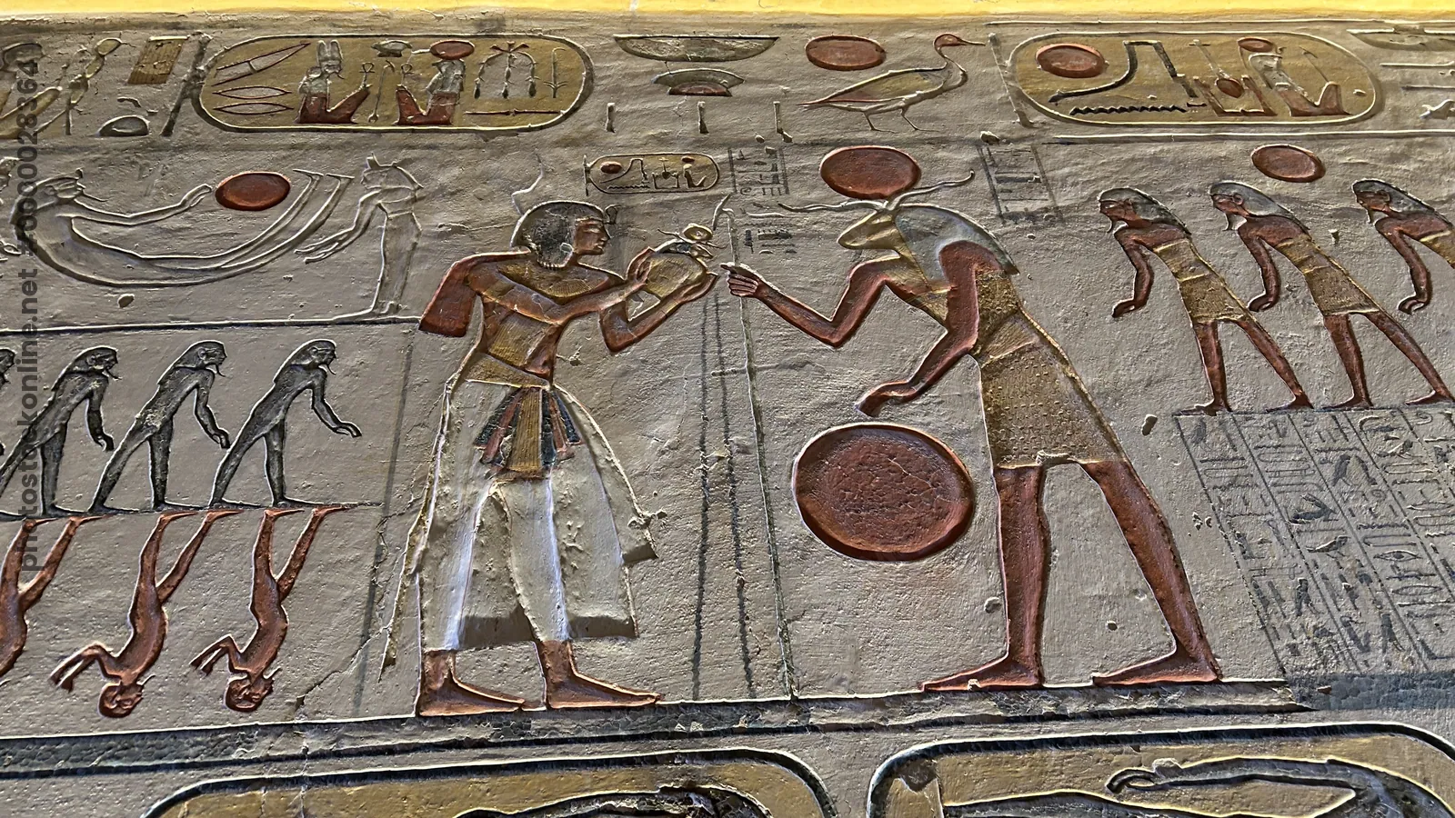 Valley of the Kings, Egypt - Feb 11, 2025: Painted relief from the Amduat showing deities, figures, and symbols in the Tomb of Ramesses IX (KV6).
