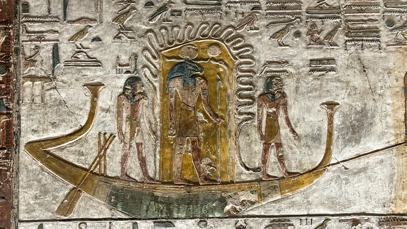 Valley of the Kings, Egypt - Feb 11, 2025: Painted relief from the fifth hour of the Book of Gates with figures and solar barque in Tomb KV17.