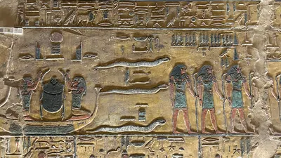 Valley of the Kings, Egypt - Feb 11, 2025: Painted relief from the first hour of the Amduat with barque of Khepri in the Tomb of Seti I (KV17).