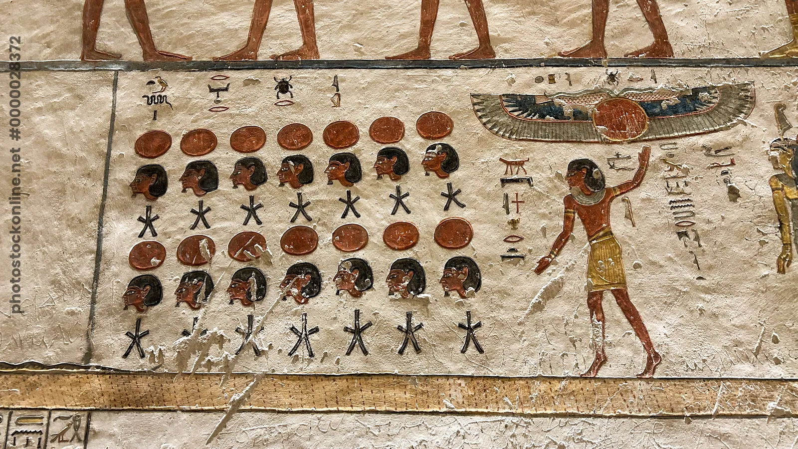 Valley of the Kings, Egypt - Feb 11, 2025: Painted relief from the fourth hour of the Amduat with figures and symbols in Tomb KV9.
