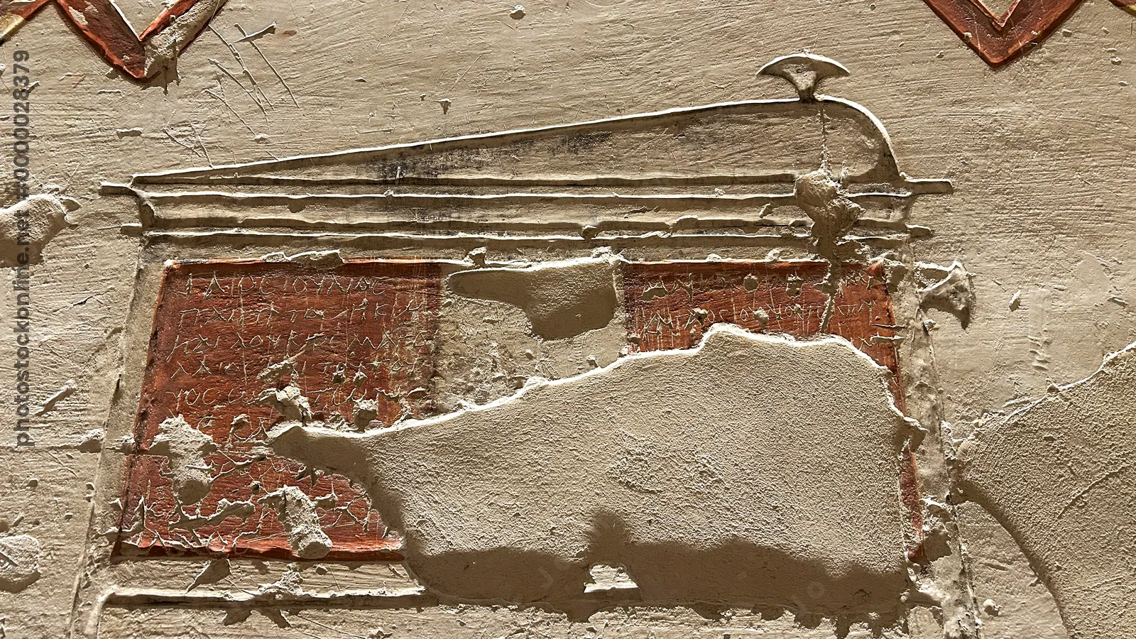 Luxor, Egypt - Feb 11, 2025: Coptic graffito on a painted panel, entrance corridor of Tomb KV2 (Ramesses IV), Valley of the Kings, Luxor, Egypt.