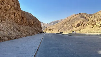 Luxor, Egypt - Feb 11, 2025: Entrance road at the Valley of the Kings, showing the pathway and transport area leading into the ancient royal necropoli