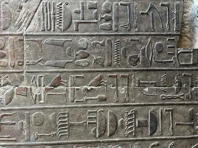 Luxor, Egypt - Feb 11, 2025: Close-up of carved hieroglyphic wall inscriptions from the Mortuary Temple of Hatshepsut at Deir el-Bahari, Luxor, Egypt.