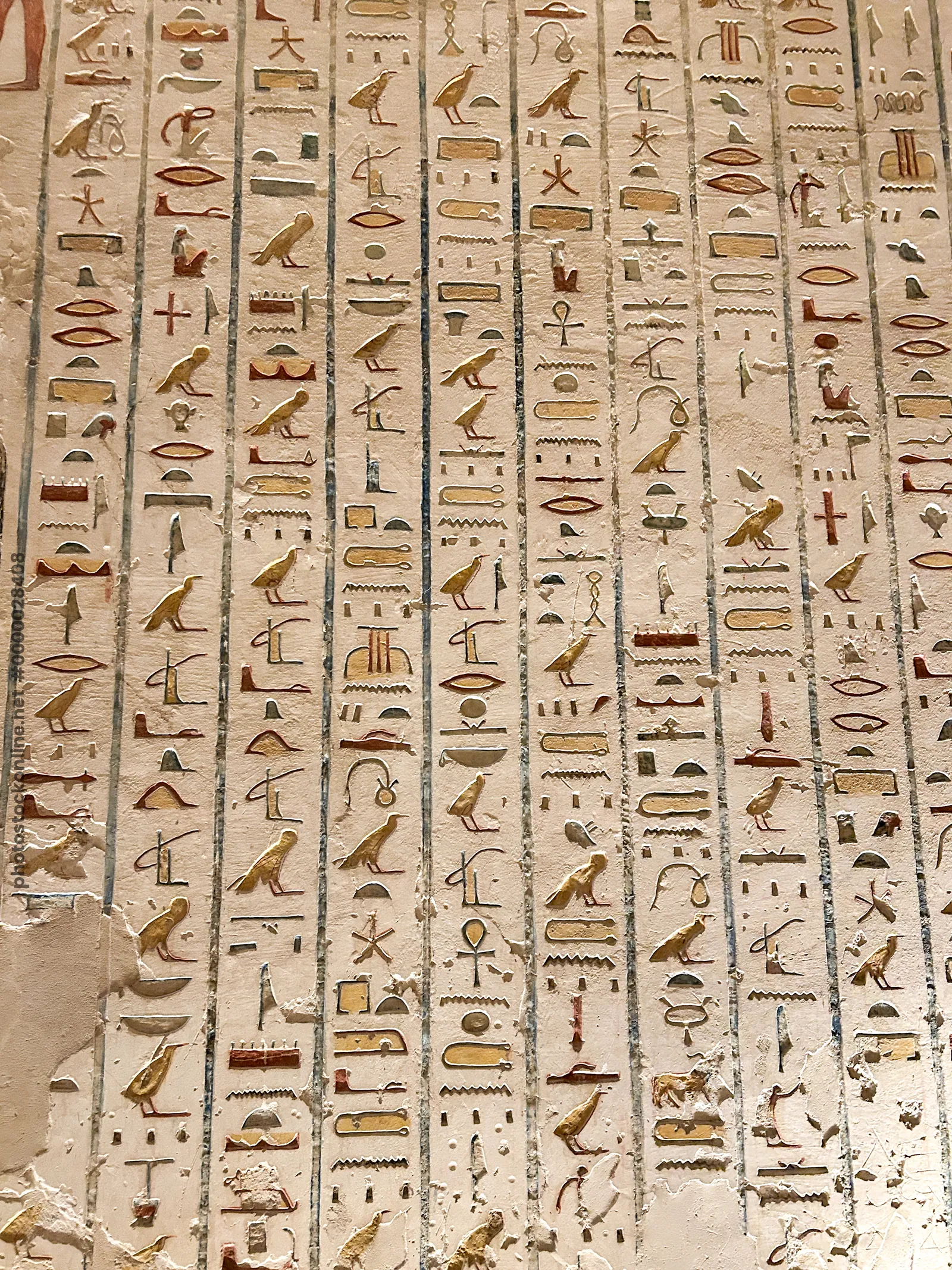 Valley of the Kings, Egypt - Feb 11, 2025: Colorful painted hieroglyphs and carvings on the wall of a royal tomb in Luxor, Egypt.