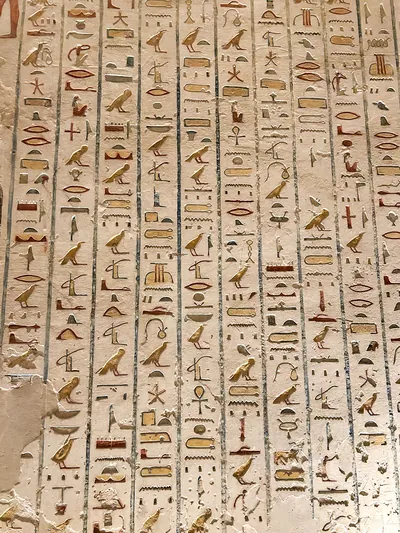 Valley of the Kings, Egypt - Feb 11, 2025: Colorful painted hieroglyphs and carvings on the wall of a royal tomb in Luxor, Egypt.
