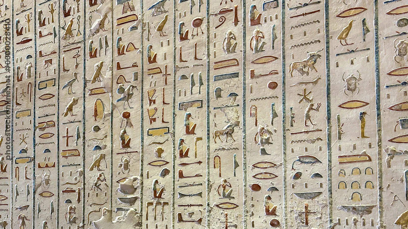 Valley of the Kings, Egypt - Feb 11, 2025: Colorful painted hieroglyphs and carvings on the wall of a royal tomb in Luxor, Egypt.
