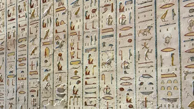 Valley of the Kings, Egypt - Feb 11, 2025: Colorful painted hieroglyphs and carvings on the wall of a royal tomb in Luxor, Egypt.