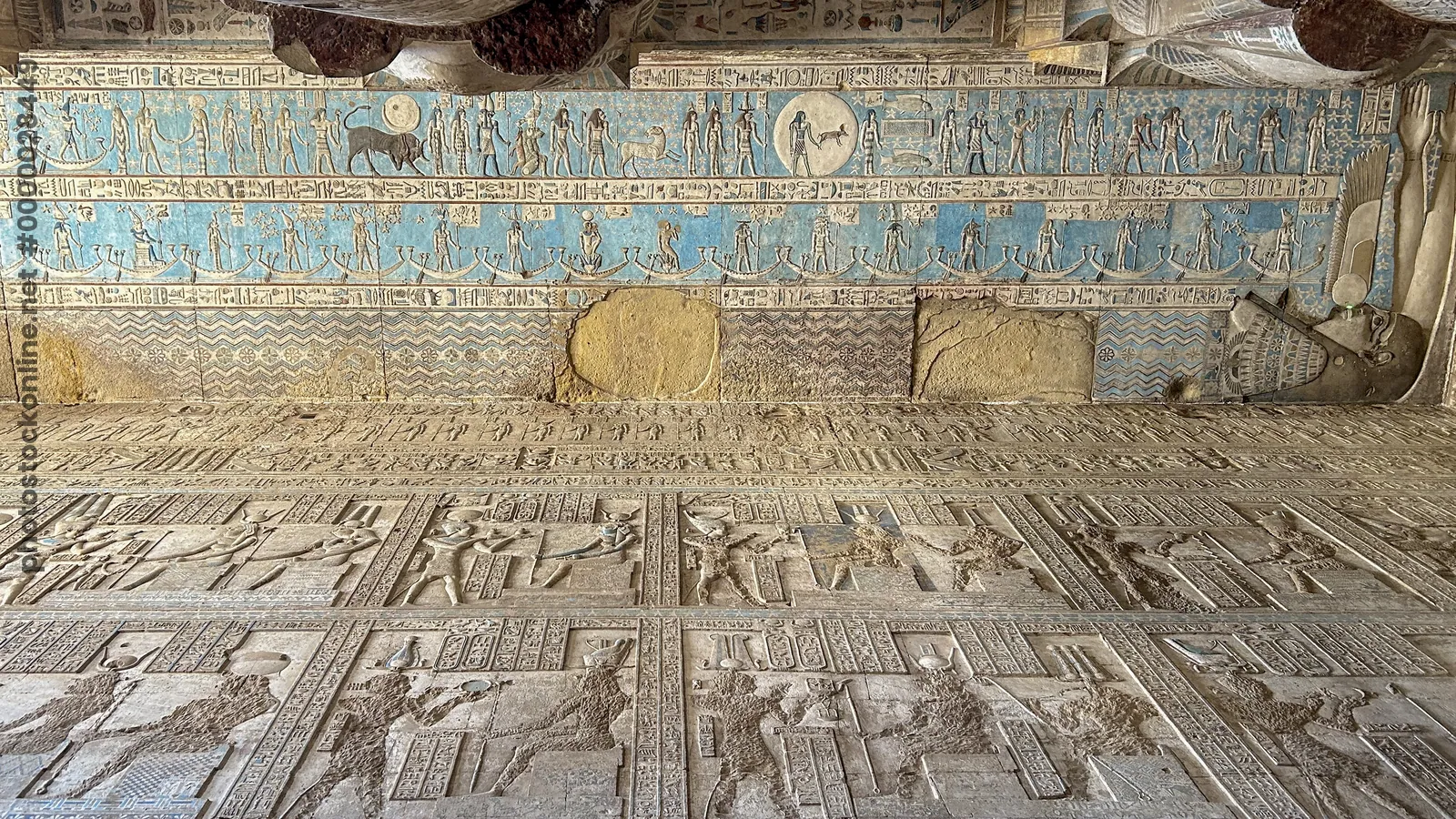 Dendera, Egypt - Feb 10, 2025: Blue-painted astronomical ceiling depicting the Egyptian sky goddess Nut with carved reliefs inside Dendera Temple in E