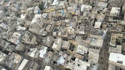 Luxor, Egypt - Feb 10, 2025: Aerial view of dense residential housing and rooftops in Luxor, Egypt, showing traditional urban architecture from a hot