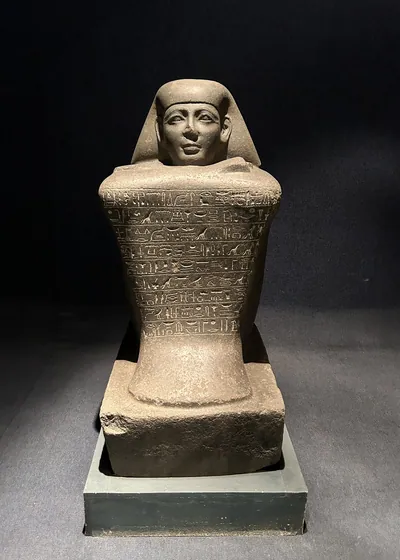 Luxor, Egypt - Feb 9, 2025: Black granite cube statue of Yamunedjeh, dating from the reign of Pharaoh Thutmose III, New Kingdom, 18th Dynasty, display